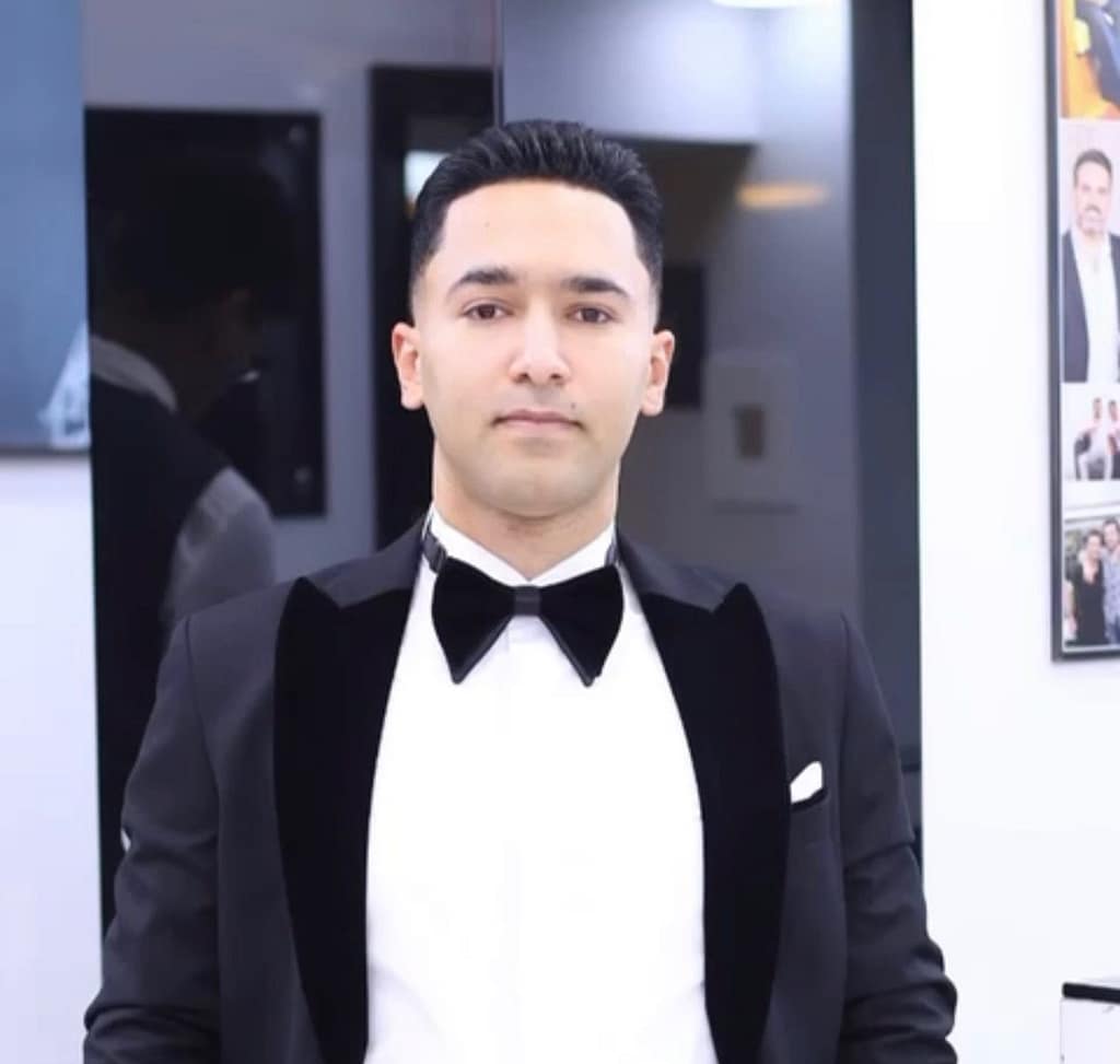 Jeremiah, owner of Fulton Variety Cleaning in West Deptford NJ, wearing a light plaid shirt and looking professional