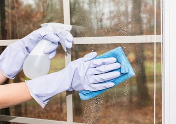 Post-construction cleanup with vacuum and debris removal from unfinished floor