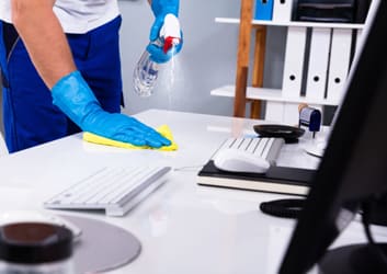 Clean modern office conference room with large windows and white table